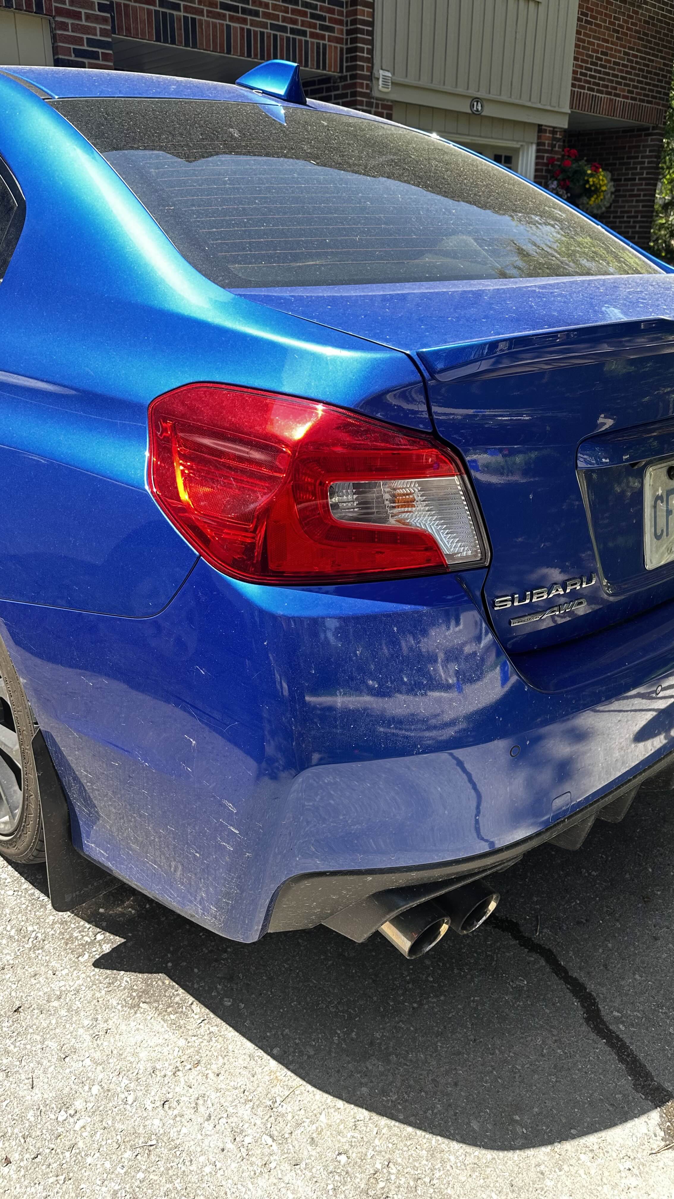 Rear, badge & exhaust — before
